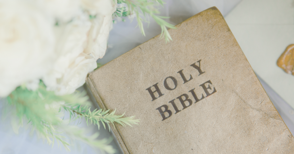 holy bible with white roses